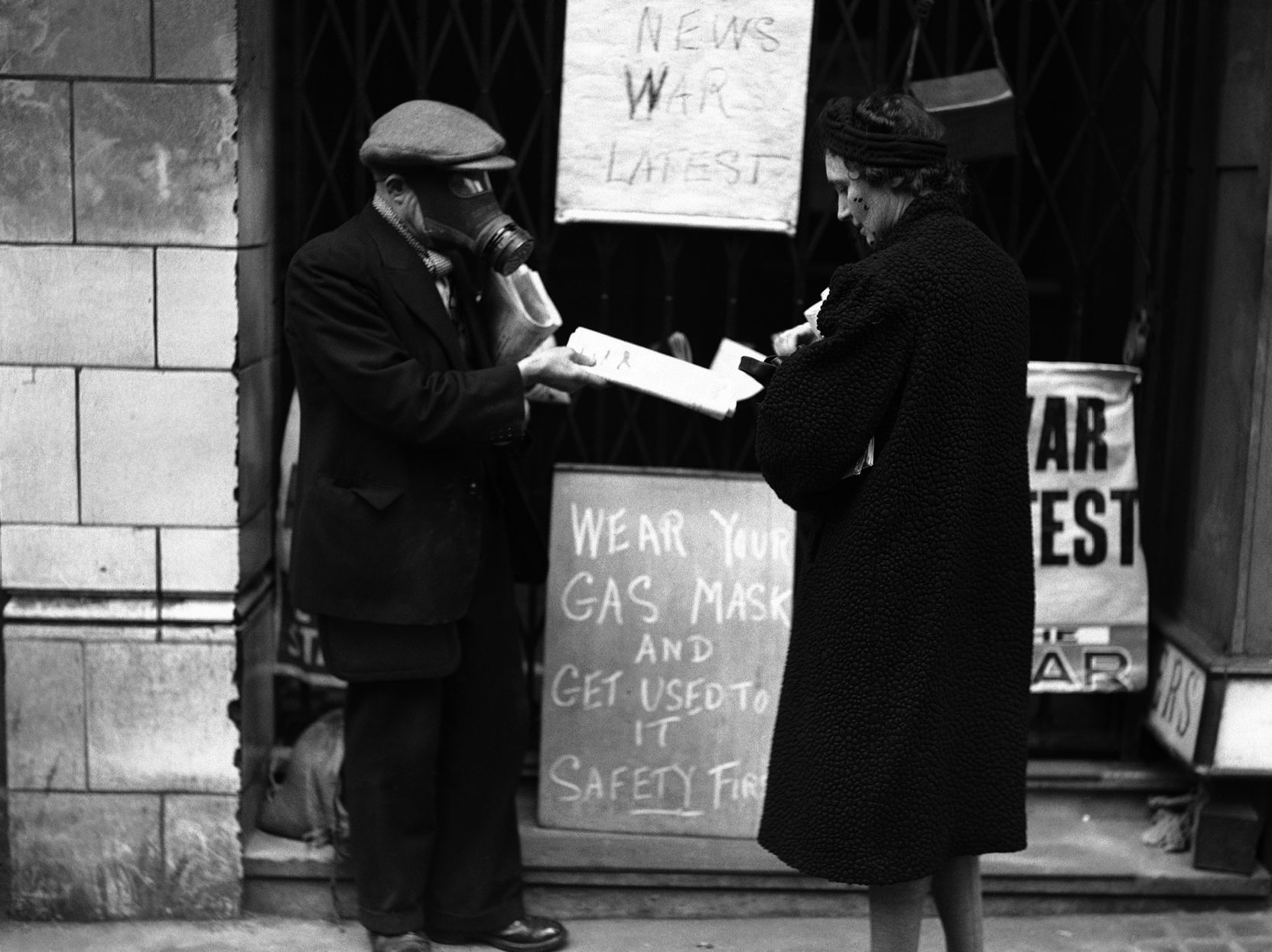 WWII London Gasmasked News Vendor